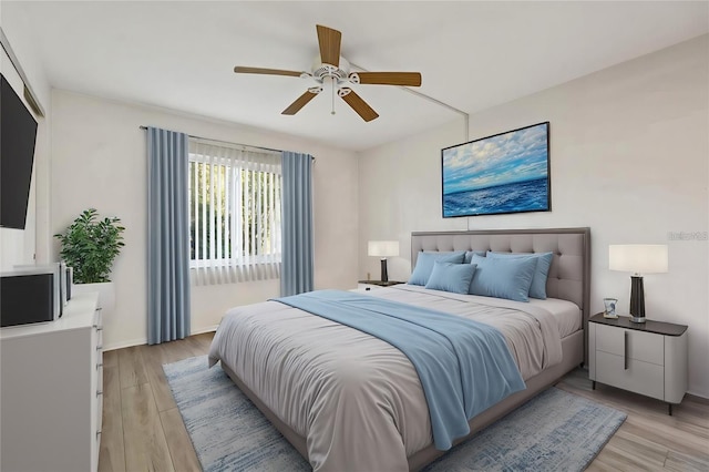 bedroom with light hardwood / wood-style flooring and ceiling fan