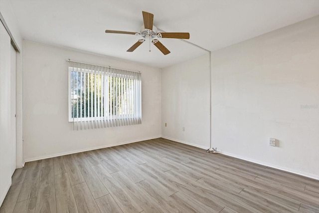 spare room featuring ceiling fan and light wood-type flooring