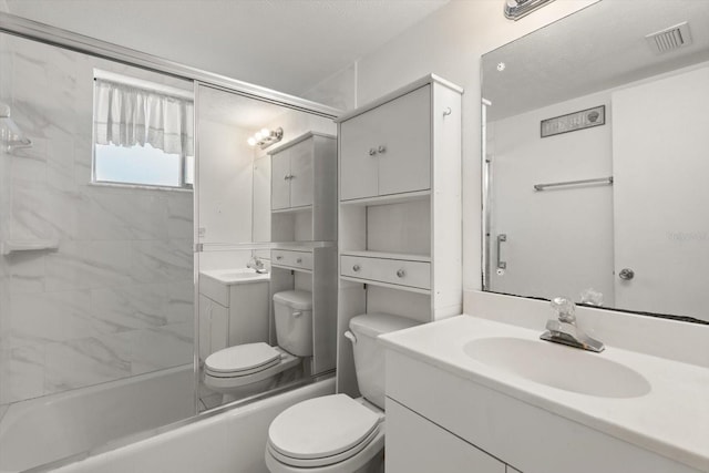 full bathroom with vanity, toilet, and tiled shower / bath combo