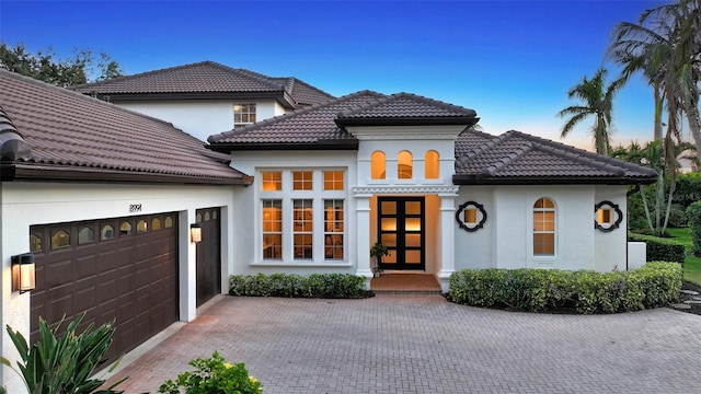 mediterranean / spanish-style house featuring a garage