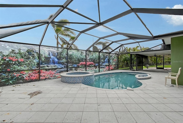 view of swimming pool featuring a lanai, an in ground hot tub, and a patio