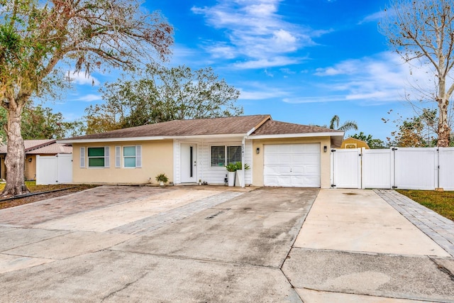 ranch-style home with a garage