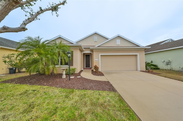 ranch-style home featuring a front lawn and a garage