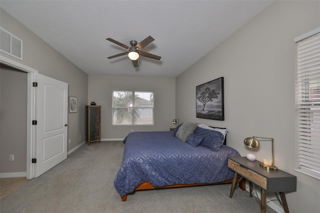 bedroom with light carpet and ceiling fan