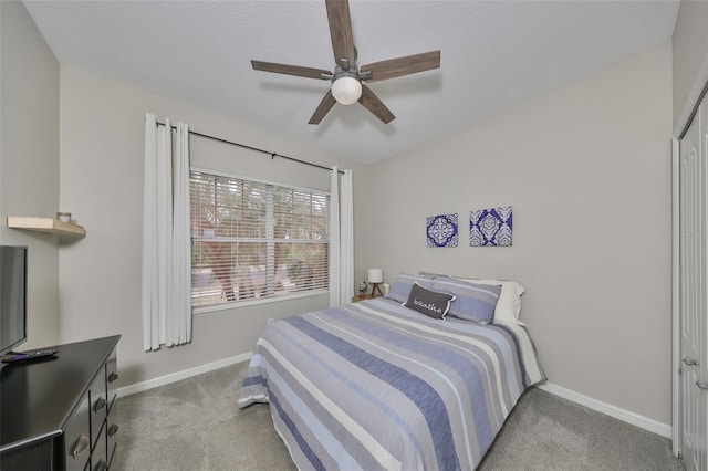 bedroom with ceiling fan and light colored carpet