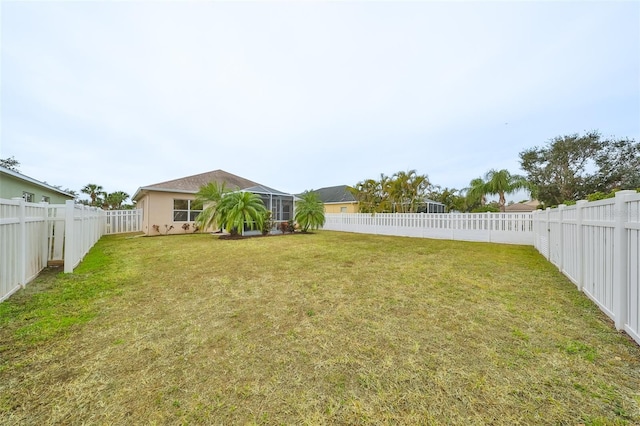 view of yard with a lanai