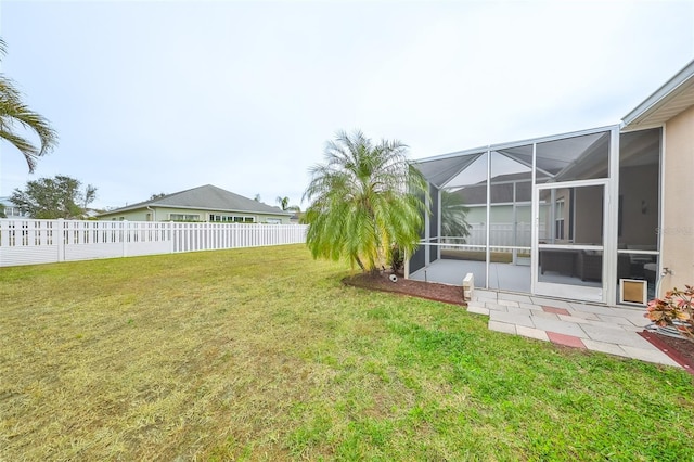 view of yard featuring glass enclosure