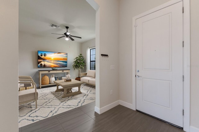 entrance foyer featuring dark hardwood / wood-style floors and ceiling fan