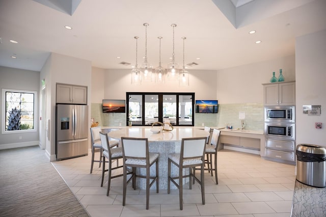 tiled dining room featuring french doors