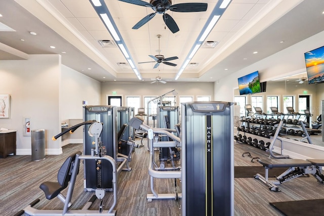 gym featuring dark carpet