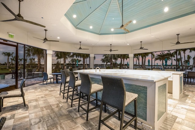 bar with wood ceiling and a tray ceiling