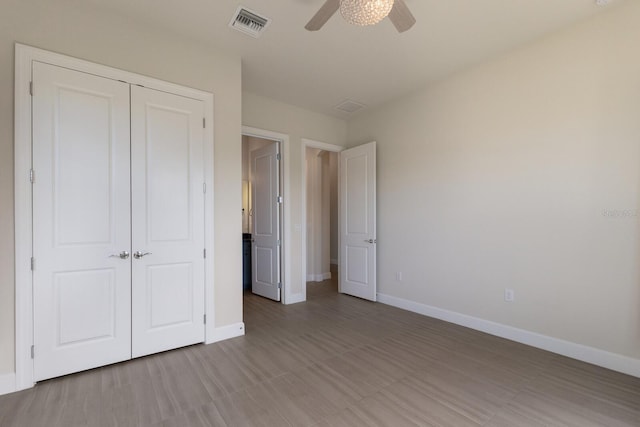 unfurnished bedroom featuring a closet and ceiling fan