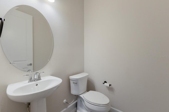 bathroom featuring sink and toilet