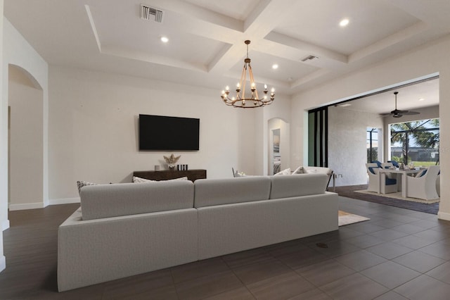 tiled living room with coffered ceiling, ceiling fan with notable chandelier, and beam ceiling