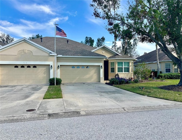 ranch-style home with a front lawn and a garage