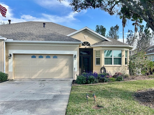 single story home with a front lawn and a garage