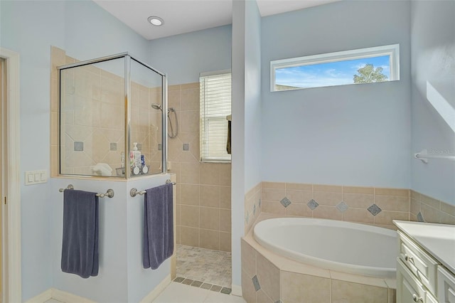 bathroom with vanity, shower with separate bathtub, and tile patterned flooring