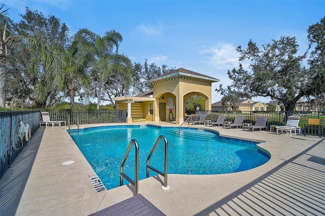 view of swimming pool featuring a patio area