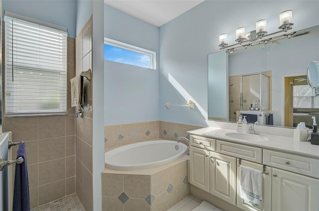 bathroom featuring vanity and plus walk in shower