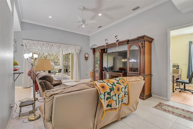 tiled living room featuring ornamental molding and ceiling fan