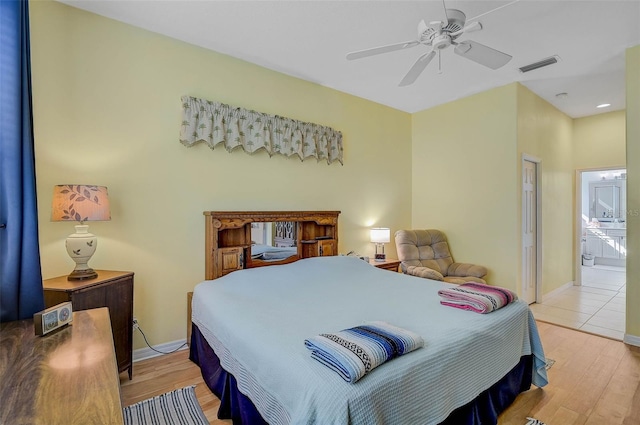 bedroom with ceiling fan and light hardwood / wood-style flooring