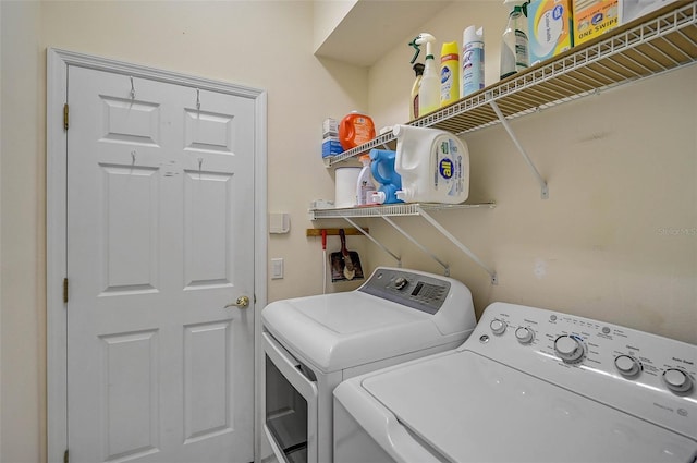 washroom with washer and dryer