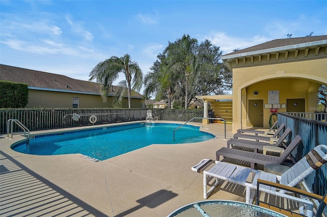 view of swimming pool with a patio area