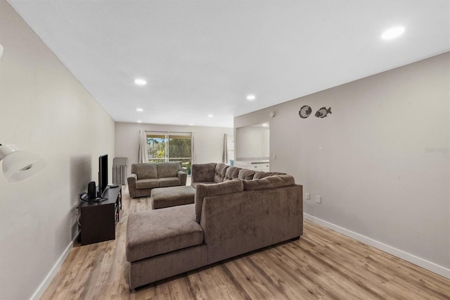 living room with light hardwood / wood-style floors