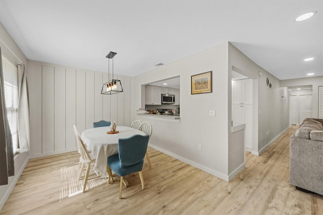 dining room with light hardwood / wood-style flooring