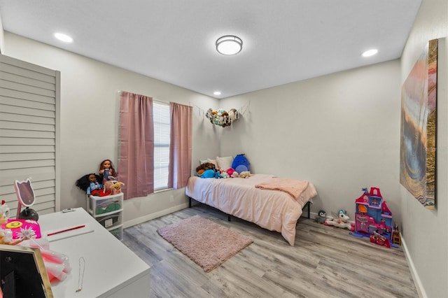 bedroom with light wood-type flooring