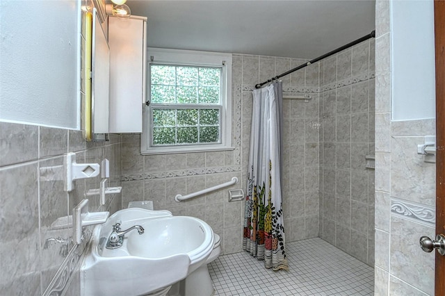 bathroom with a shower with shower curtain, tile walls, and tile patterned floors