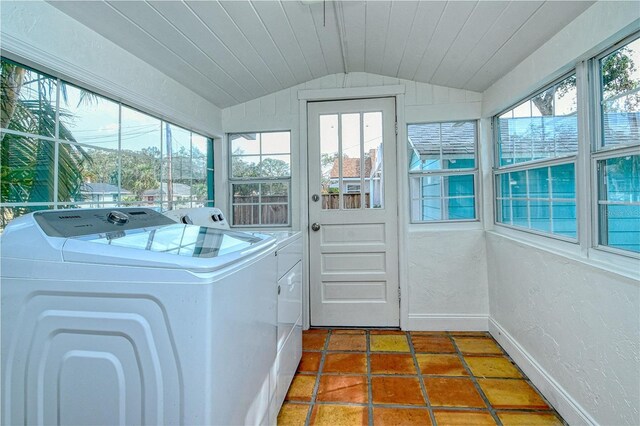 laundry room with washing machine and dryer and wood ceiling