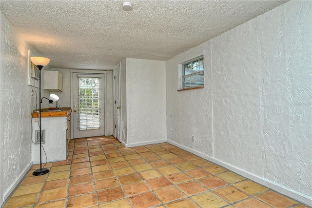 interior space with sink and a textured ceiling