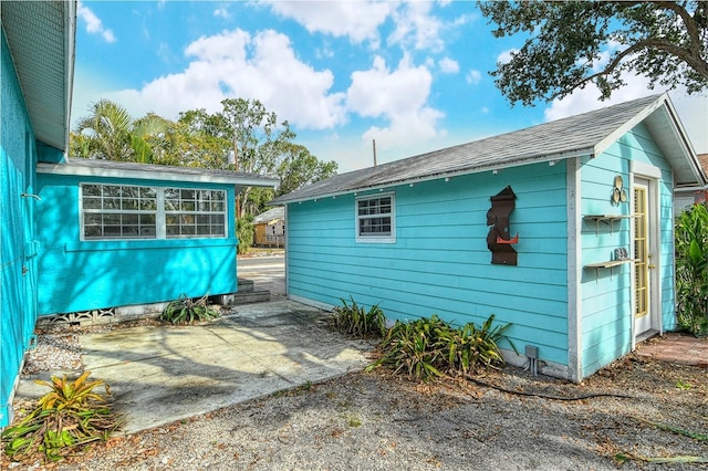 view of property exterior with a patio