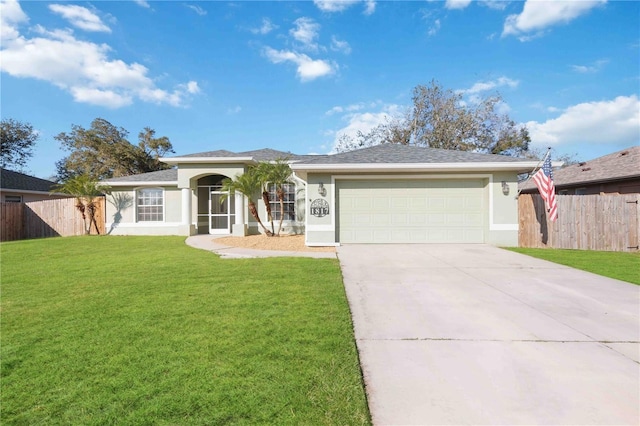 ranch-style house with a garage and a front lawn