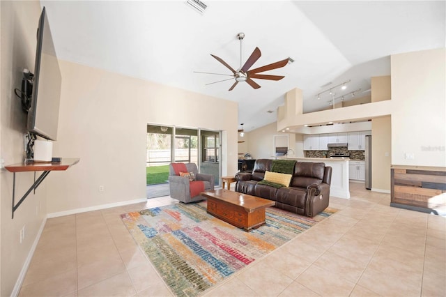 living room with light tile patterned flooring, high vaulted ceiling, and ceiling fan