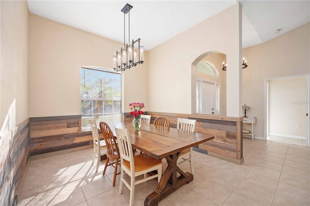 dining room featuring light tile patterned floors and a notable chandelier