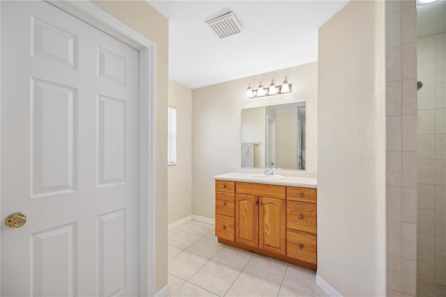 bathroom featuring tile patterned floors and vanity