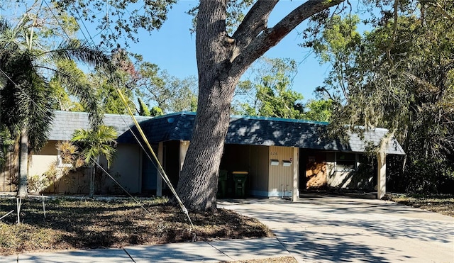 view of front of home with a carport