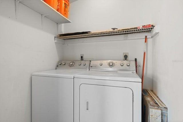 laundry area featuring laundry area and washer and clothes dryer