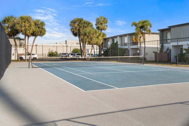 view of tennis court with fence