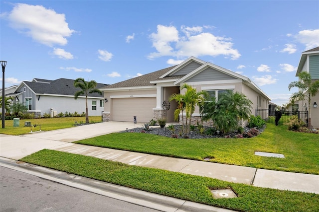 view of front facade with a front yard and a garage