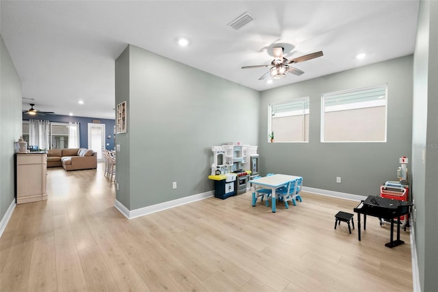 rec room featuring ceiling fan and light hardwood / wood-style floors