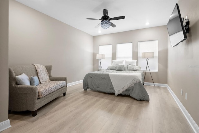 bedroom featuring ceiling fan and light hardwood / wood-style flooring