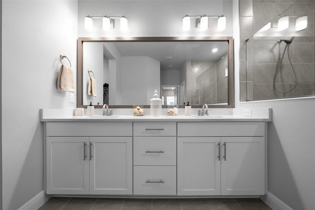 bathroom with vanity, tile patterned floors, and a shower