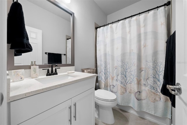 bathroom with vanity, tile patterned floors, and toilet