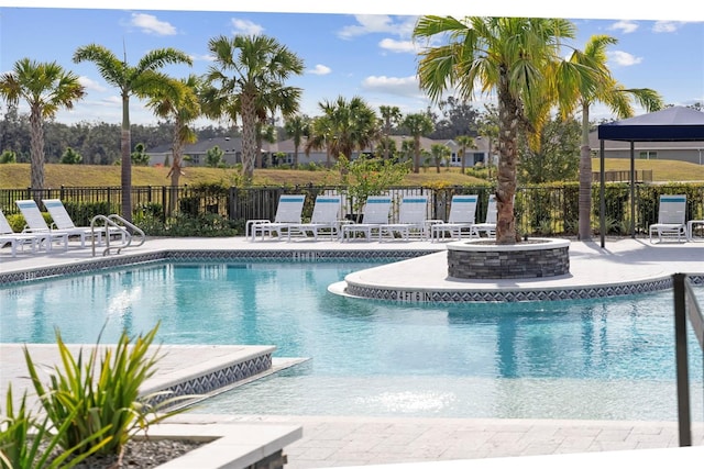 view of swimming pool with a patio area