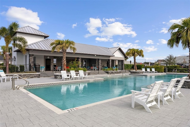 view of swimming pool with a patio area