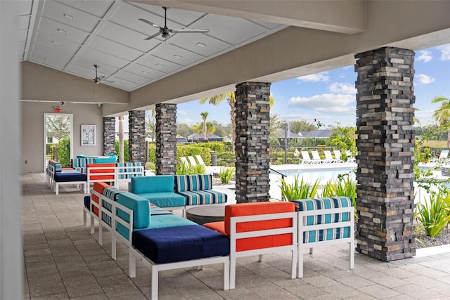 view of patio with outdoor lounge area, a swimming pool, and ceiling fan