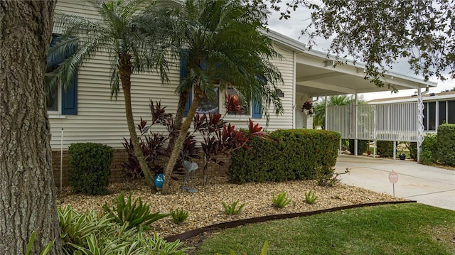 view of front of property featuring a carport